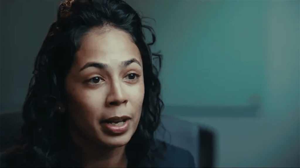 Woman looking to her left in the middle of an interview