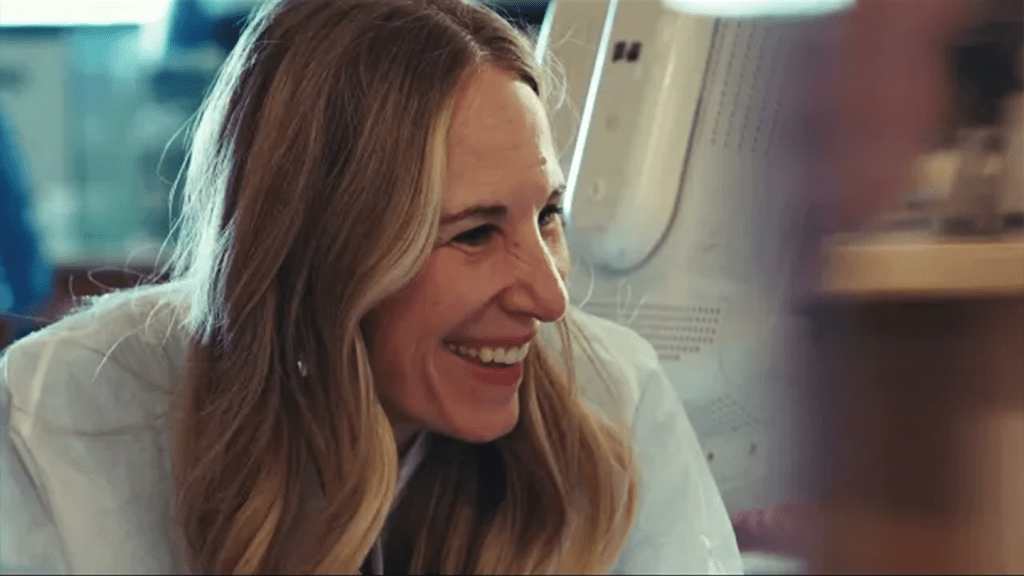 Woman smiling looking to her left